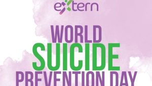 Poster for World Suicide Prevention Day featuring the Extern logo at the top and large purple and green text reading “World Suicide Prevention Day” on a light purple watercolor-style background.